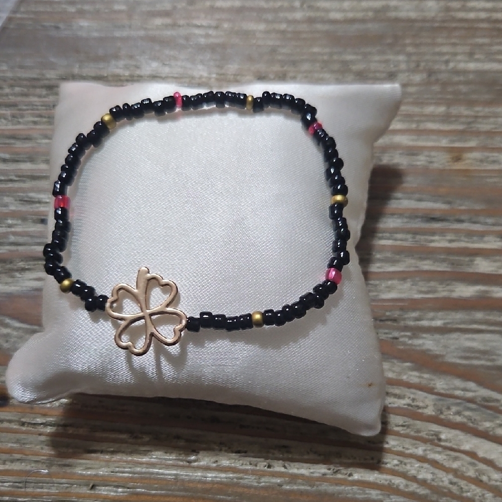 Black and Gold Beaded Bracelet with Clover Charm